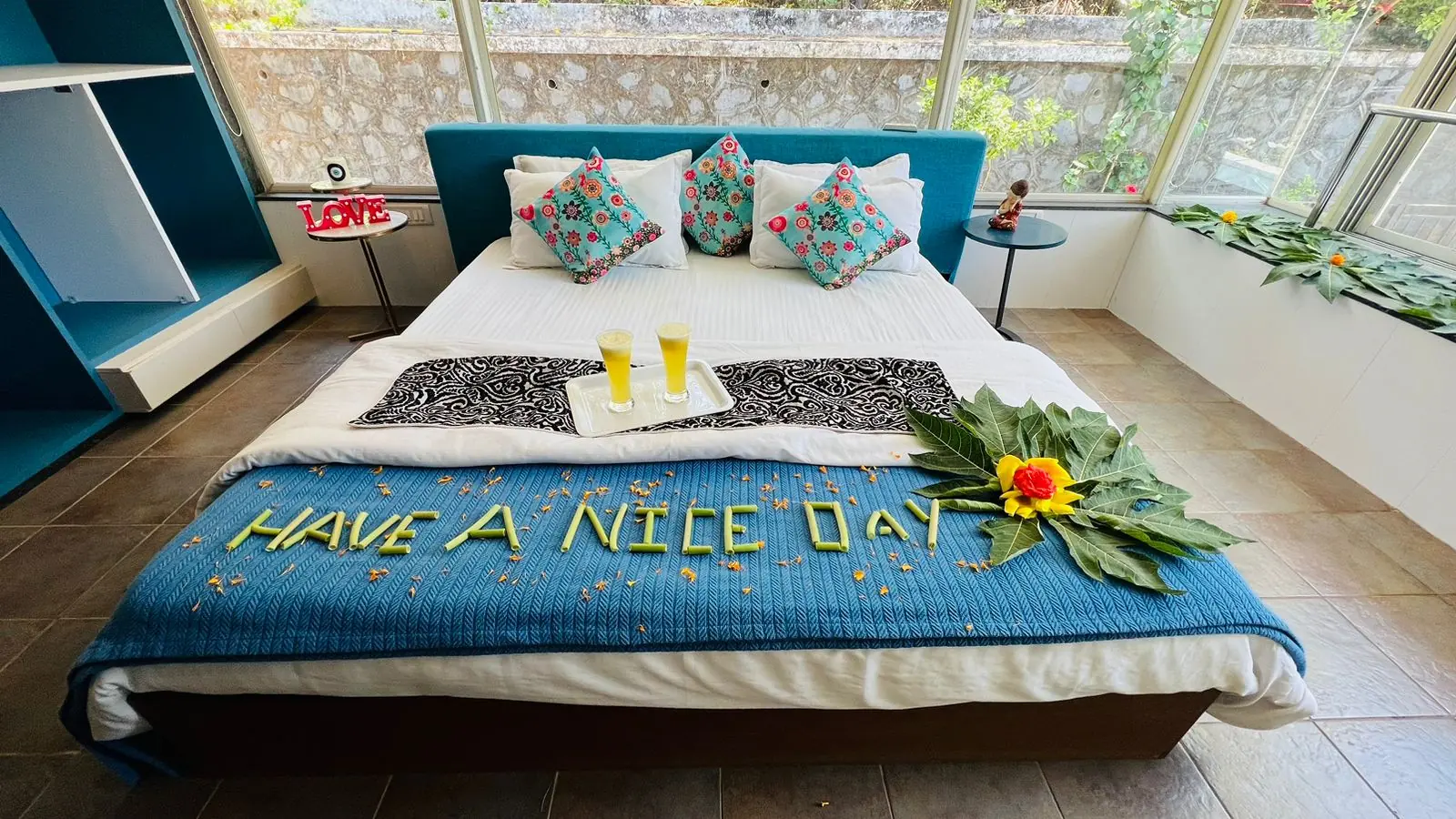 Bedroom with garden-facing glass wall — Carpe Diem, Lonavala