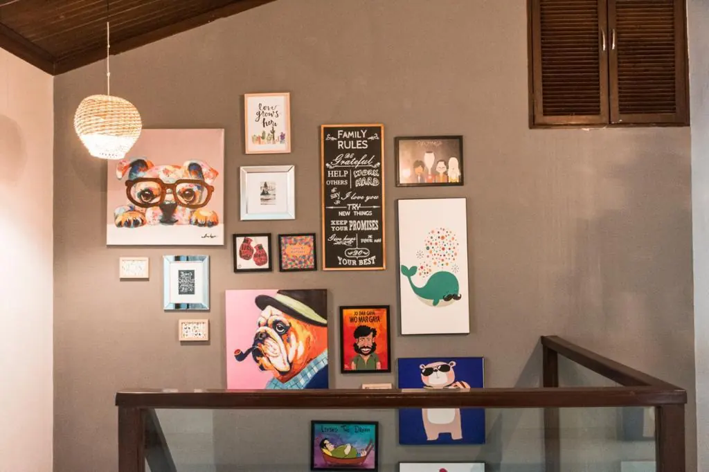 Artwork along the upper landing — Carpe Diem, Lonavala