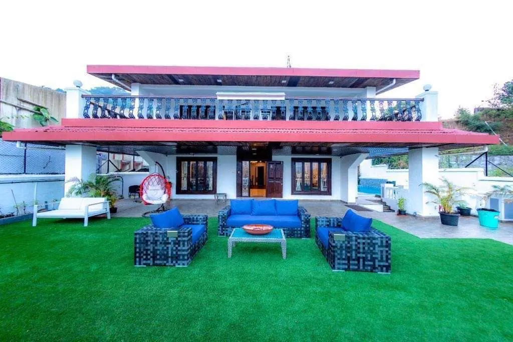 Outdoor lounge seating on the lawn — Carpe Diem, Lonavala