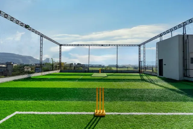 Villas in Igatpuri with a turf — rooftop cricket turf at Greenwood Villa