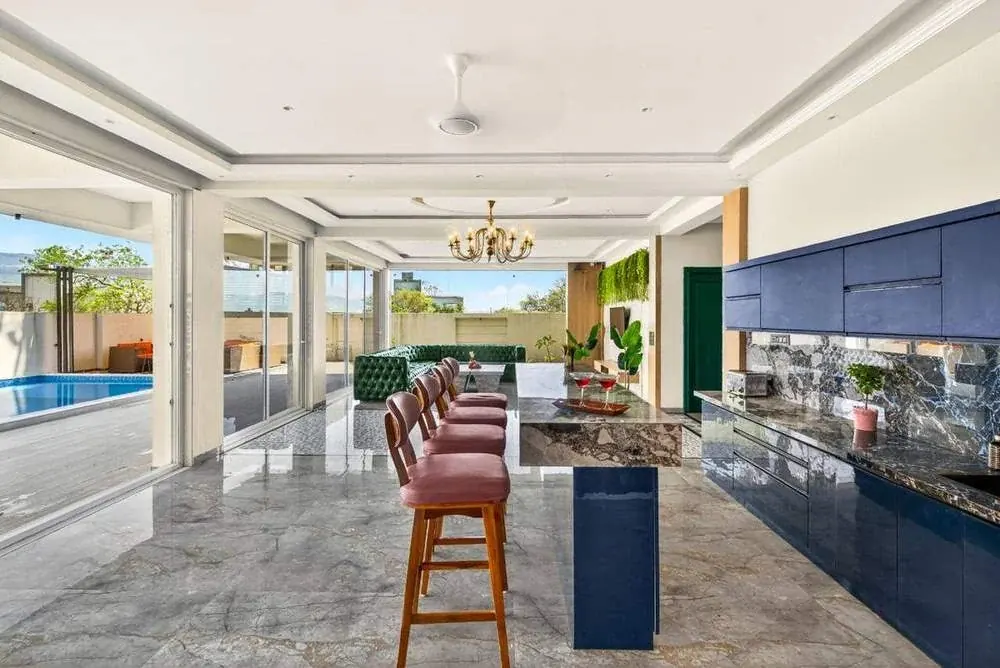 Modular kitchen with bar counter — Greenwood Villa, Igatpuri