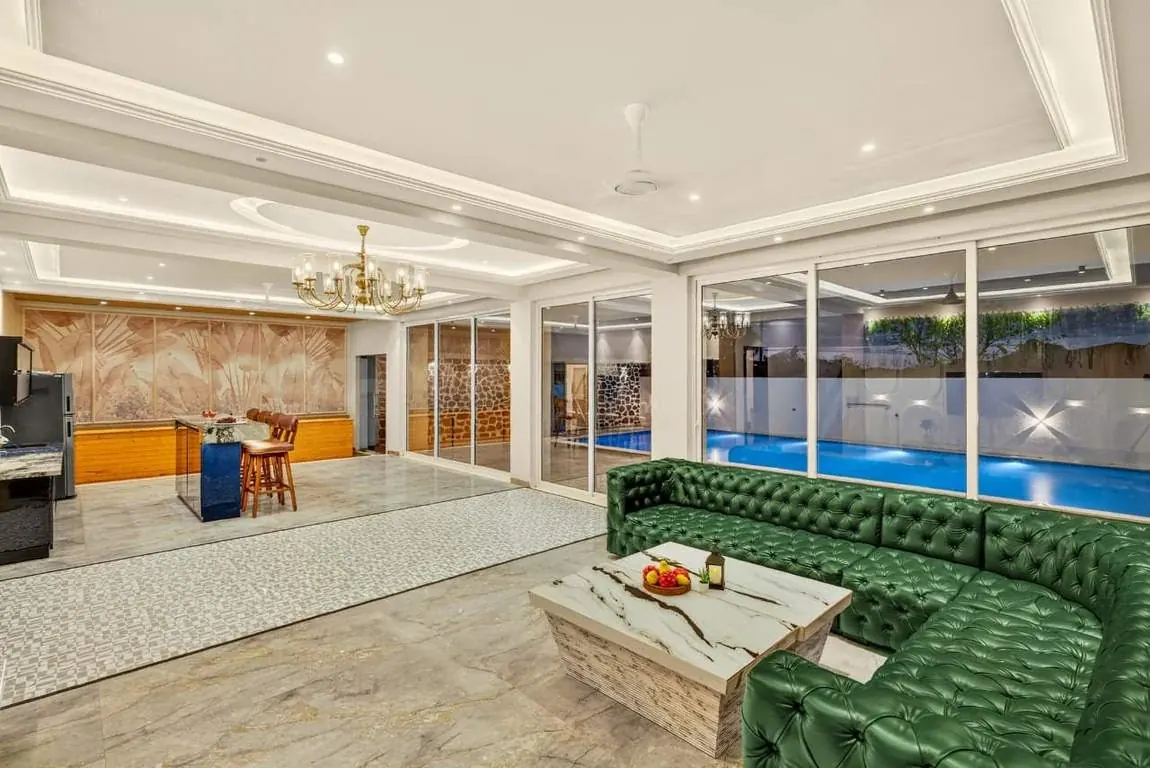 Living hall opening onto the pool — Greenwood Villa, Igatpuri