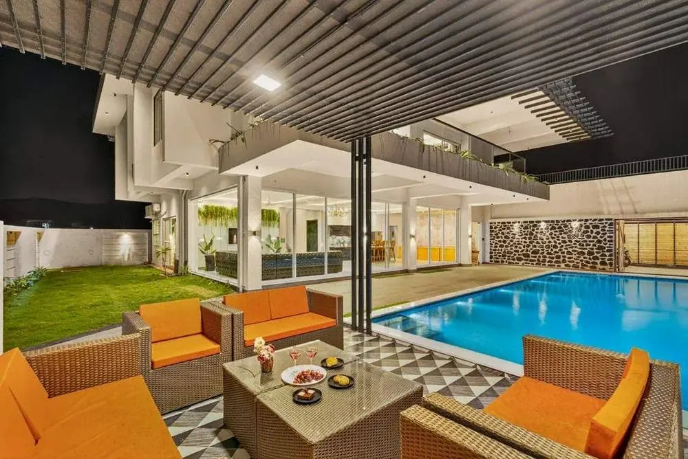Poolside lounge seating — Greenwood Villa, Igatpuri