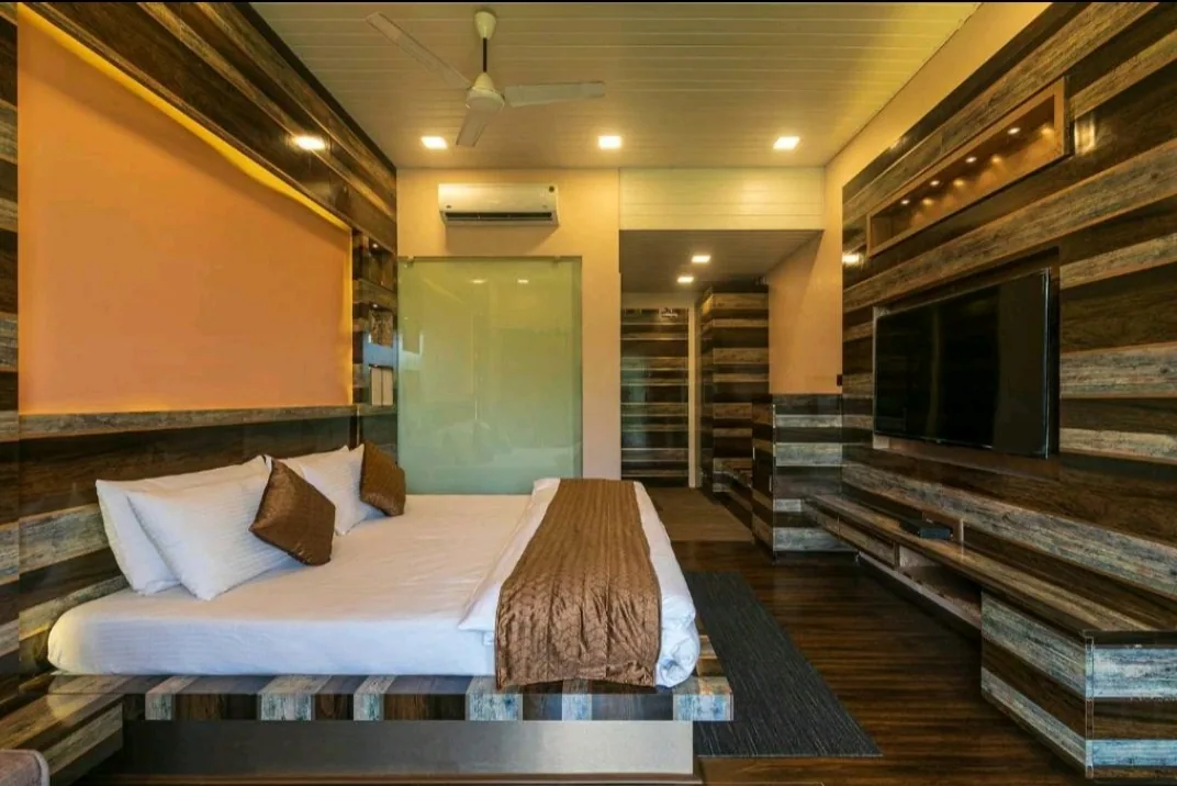 Living area with the 55-inch screen — Heritage Villa, Nagaon Alibaug