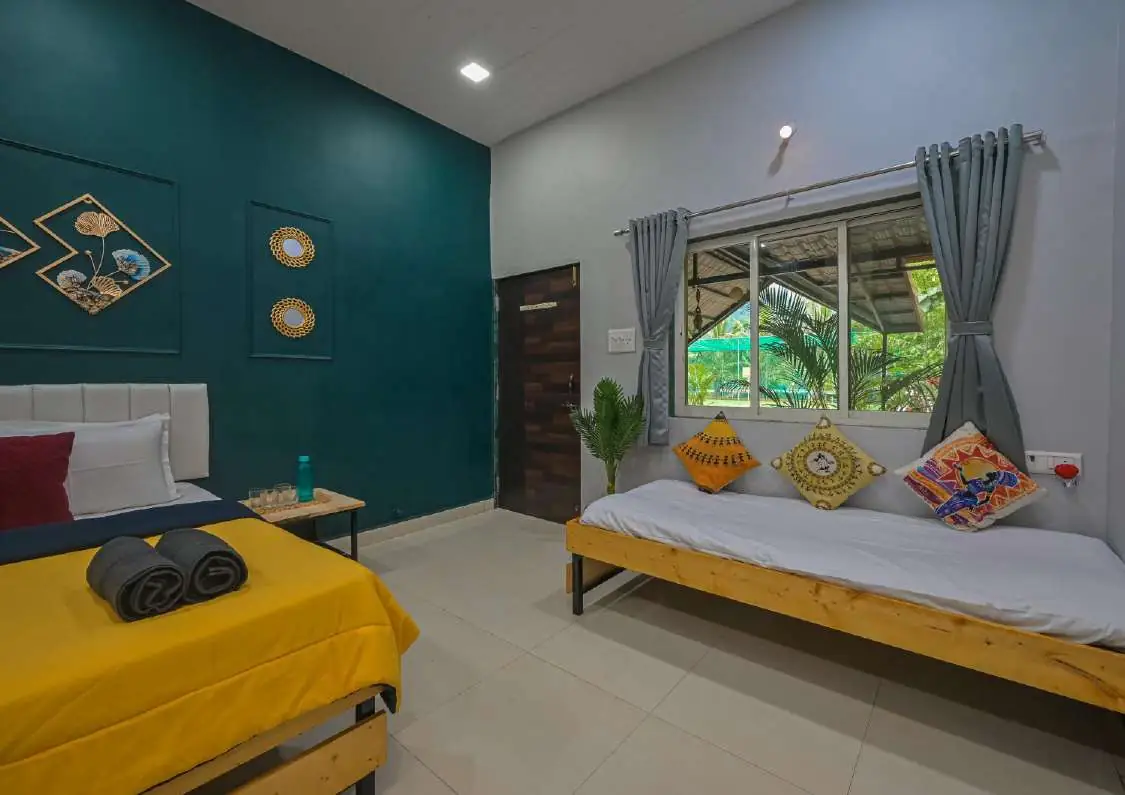 Bedroom with extra bed — Karvi Farm, Karjat