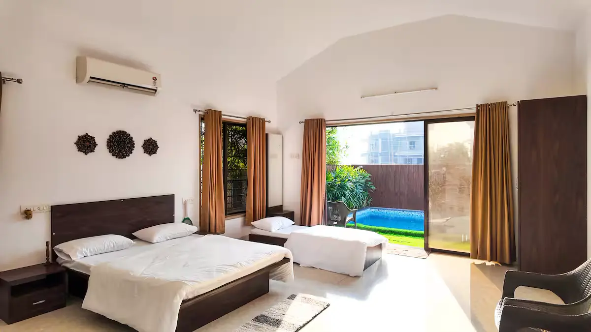 Bedroom overlooking the pool — Madhavi's Villa, Lonavala