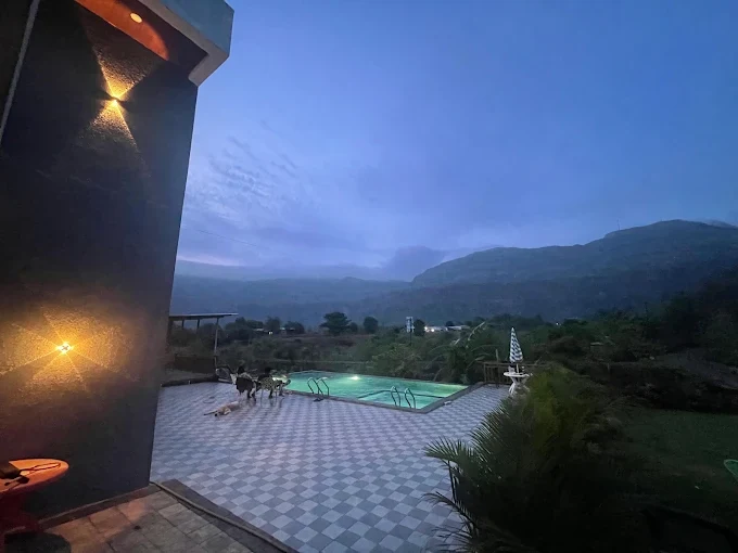 Infinity pool looking into the valley — Majestic Cascade Villa, Karjat