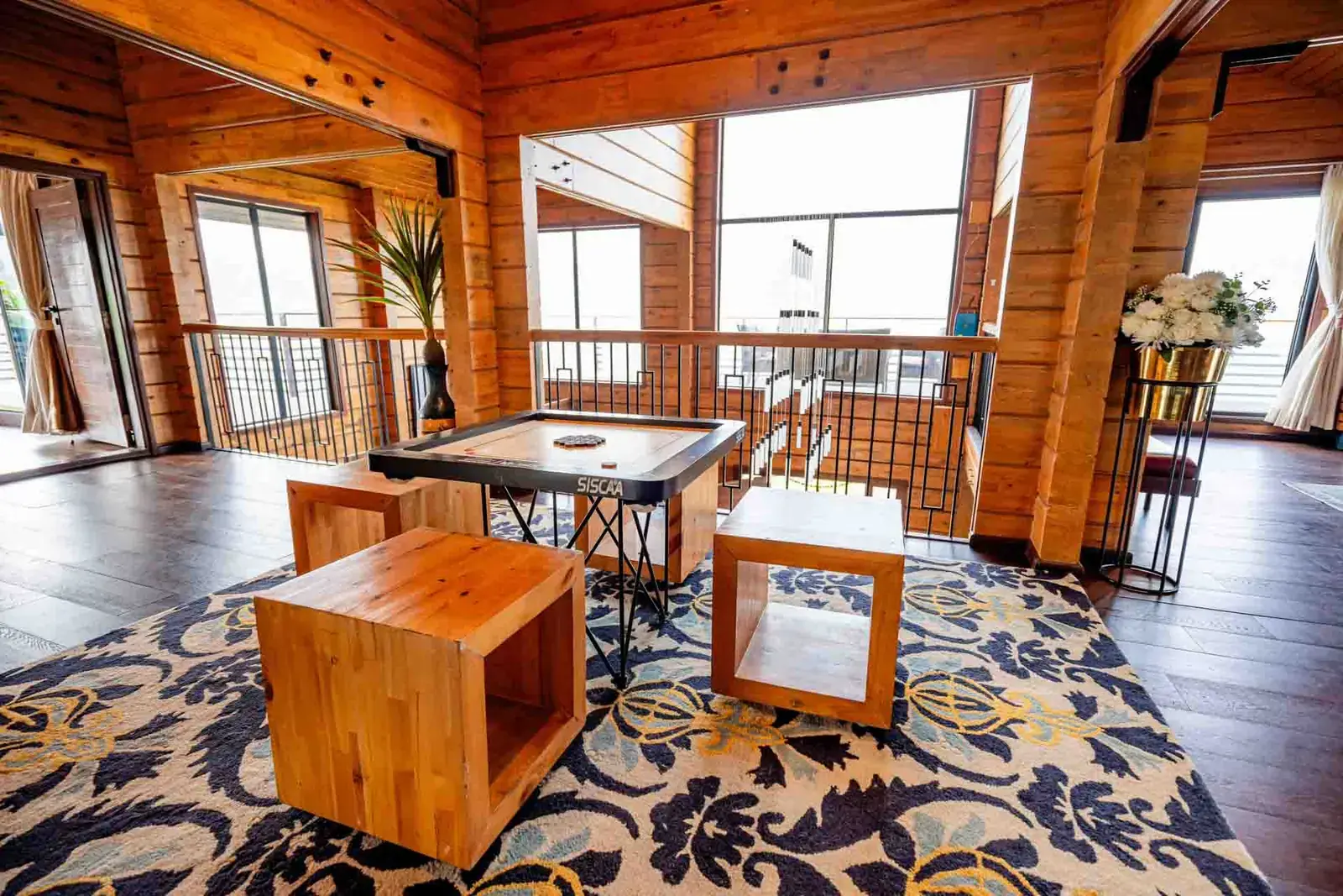 Mezzanine lounge with carrom board — Mantra 147, Pawna Lake, Lonavala