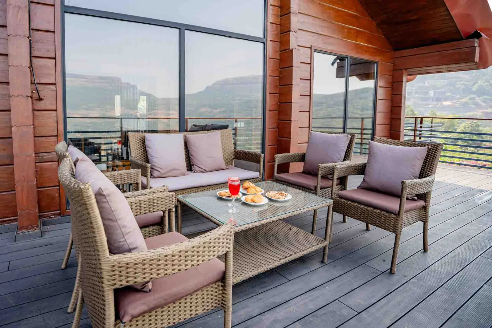 Wooden deck seating with mountain views — Mantra 147, Pawna Lake, Lonavala