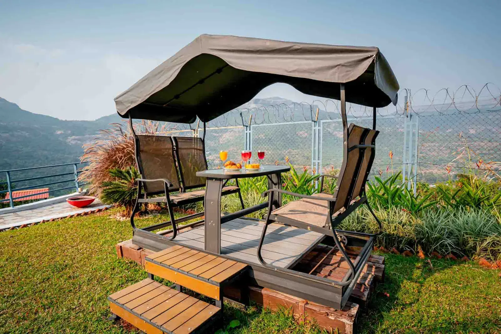 Garden swing overlooking the Pawna valley — Mantra 147, Pawna Lake, Lonavala