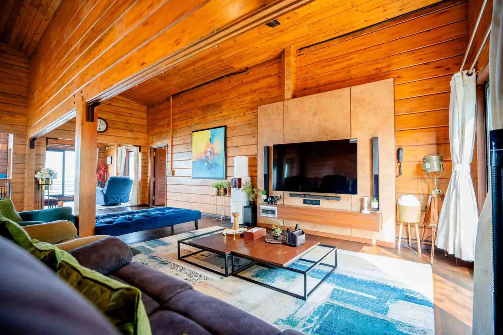 Second living area with large TV and music system — Mantra 147, Pawna Lake, Lonavala