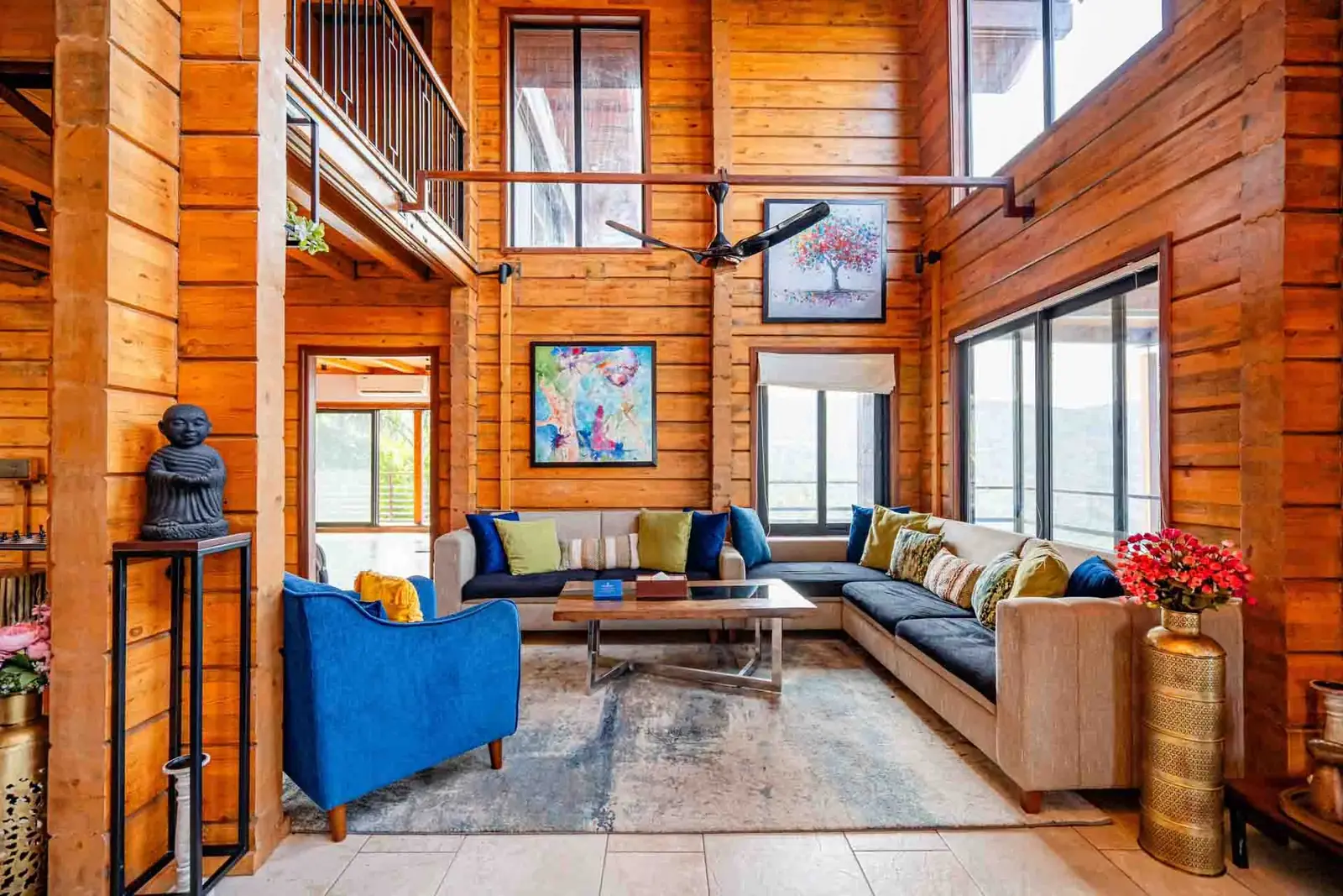 Double-height living room in solid pine — Mantra 147, Pawna Lake, Lonavala