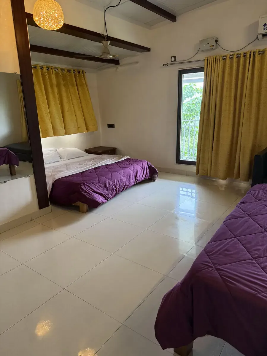 Bedroom with a full-length mirror — Misty Cascades, Karjat