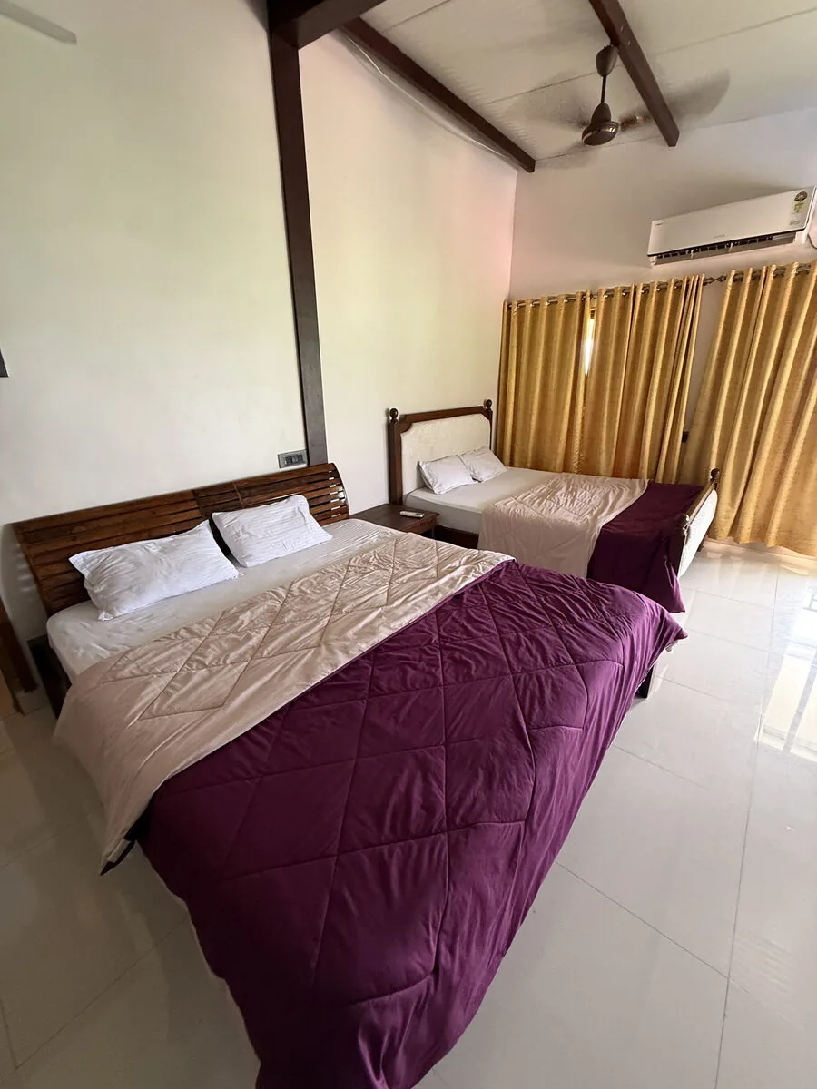 Bedroom 1 — two king beds, air-conditioned — Misty Cascades, Karjat