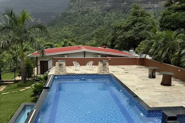 Misty Cascades, Karjat — infinity pool with waterfall views