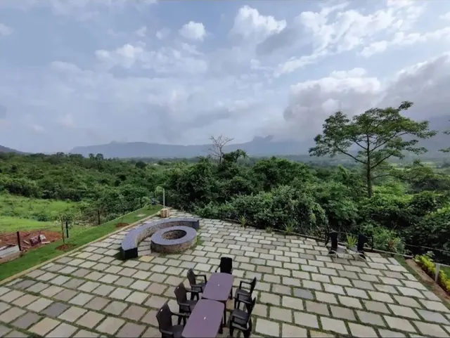 The patio deck and fire pit, looking out over the valley — Misty Cascades, Karjat