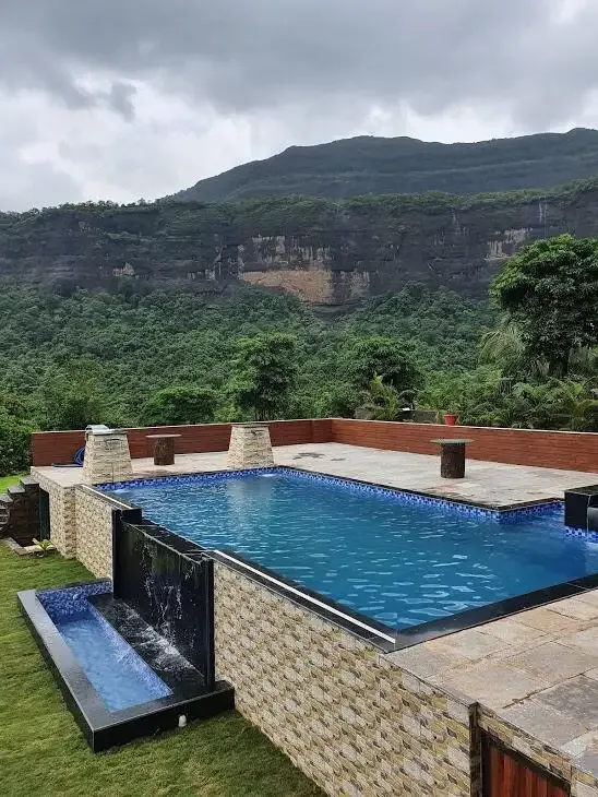 Pool deck looking towards the falls — Misty Cascades, Karjat